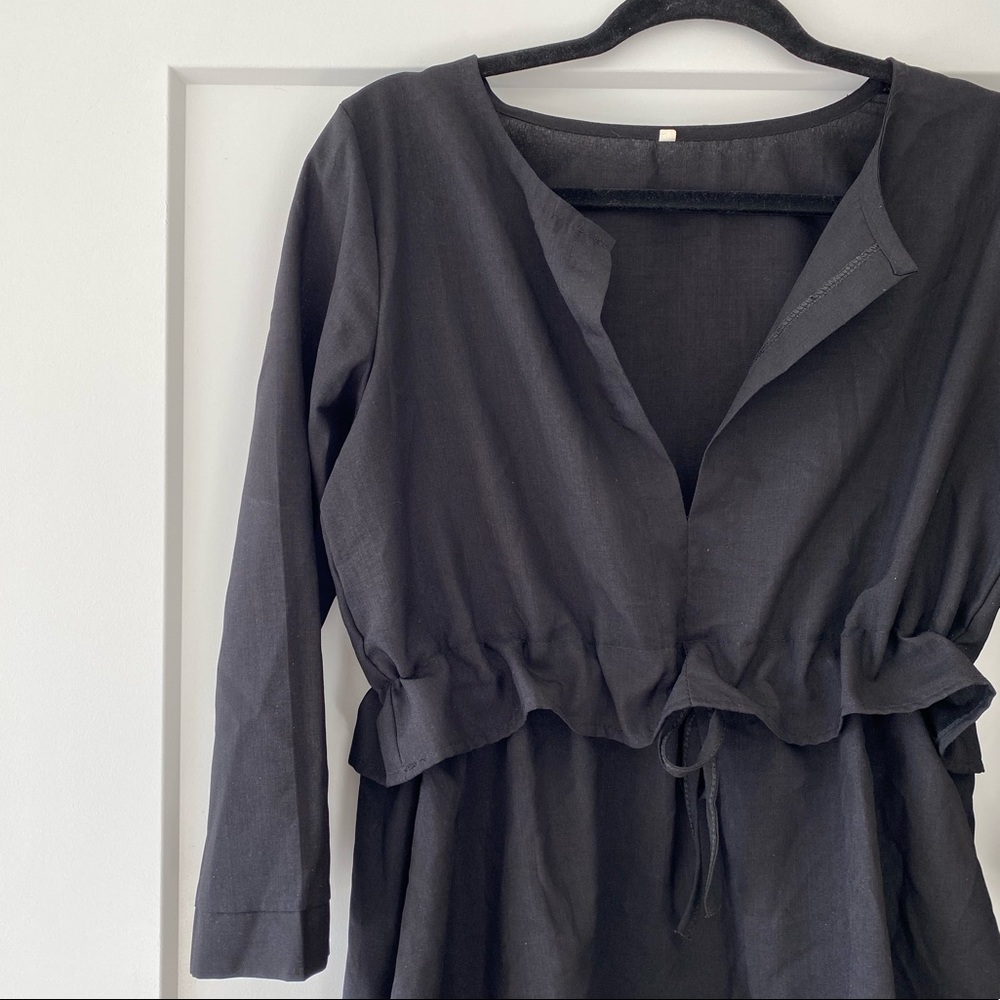 Quarter sleeve black v neck blouse with drawstring waist